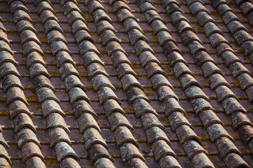 Fragment of a roof the covered with old clay tile, natural texture