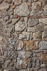 Fragment of old stony wall, natural texture