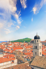 Fototapeta na wymiar Beautiful view of the bell tower and the island Lokrum in the old town of Dubrovnik, Croatia