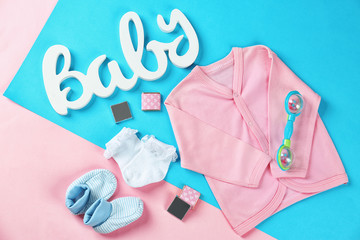 Gifts for baby shower on color background