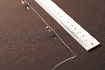 Fototapeta premium Fabric with pattern template and ruler, closeup