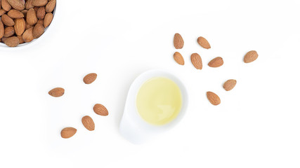 Almond oil isolated on white background, top view