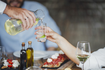 A Man Pouring Drink at Party