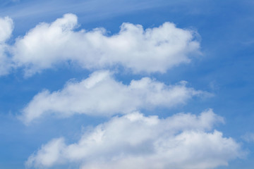 abstract white clouds on clear blue sky background in tropical climate 