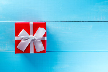 Gift trends. Thinking about new year, Christmas and valentine day gifts and online shopping. Red box present with bow