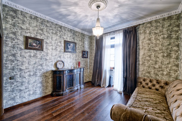 Russia,Moscow - the interior living room wooden country house.
