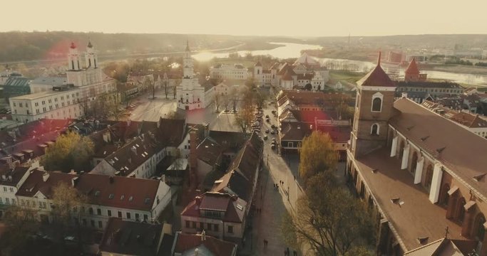 AERIAL. Drone shot of Town Hall in Town Hall square in Kaunas, Lithuania. Spring (color graded)