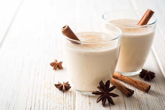 Eggnog Glasses Cinnamon Wooden Table Stock Photo by ©5seconds