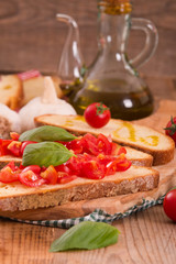 Bruschetta bread with basil and chopped tomatoes. 