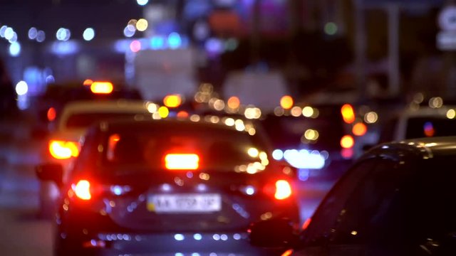 Slow Flow On A Freeway At Night. Cars in traffic jam.