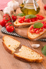 Bruschetta bread with basil and chopped tomatoes. 
