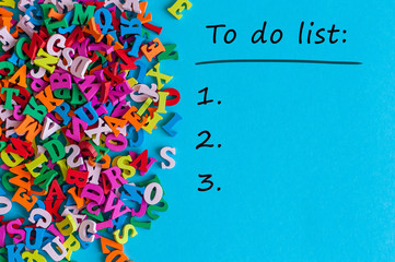 To do list conceptual. Mockup with empty space and many little alphabet letters at blue background