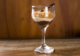 Italian dessert tiramisu in glass with peanut, sweet food
