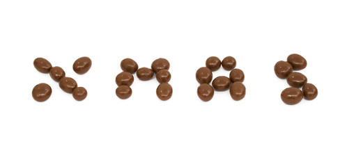Christmas word written with Chocolate balls isolated on white background