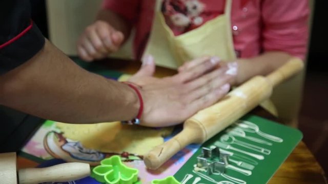 Children make cookies from their own form. Children make dough, roll it out with a rolling pin and with the help of different forms make a beautiful cookie yourself