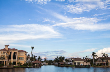 Blue Sky Over Tropical Residential Homes - 182854330