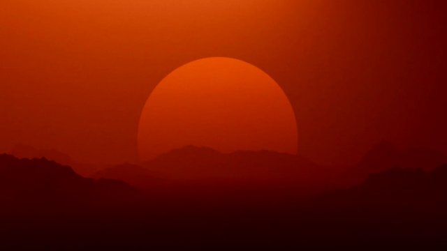 Red planet, Mars sunset landscape with big sun on the horizon.