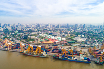 Port with city logistics and transportation of Container Cargo ship and Cargo plane with working crane bridge