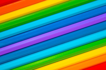 Background of multicolored wooden pencils. Rainbow colors. Diagonal..