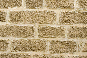 Stone old wall background with large-sized stones close-up