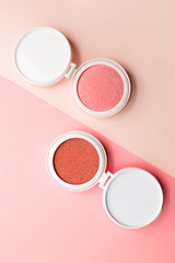 Two blushes for make-up in the form of a cushion on dowble background