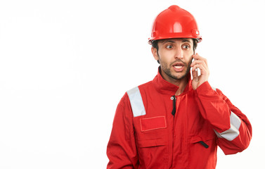 Young builder worker in red hardhat