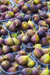 Background of ripe juicy figs on the market stalls shot close-up