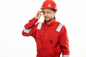 Young engineer worker in red helmet