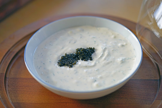 Black sturgeon caviar on top of creme fraiche cream