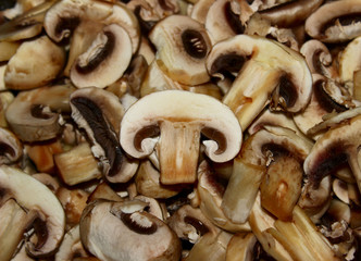 Healthy Food Background. Mushrooms Champignons. Fried mushrooms close up.Background Of Sliced Mushrooms.