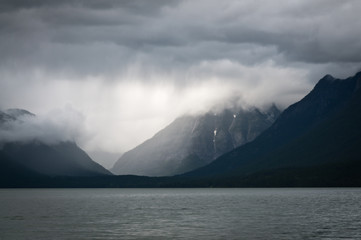 Fototapeta na wymiar Heavy clouds over a mountain lake