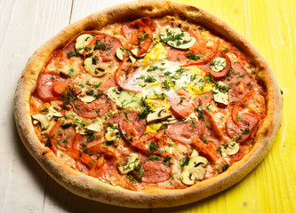 Take away food with red sauce and crunchy edges.