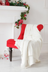 Obraz premium Red chair with white paid in a white photostudio
