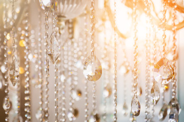Luxury crystal chandelier close-up. Glamour background with copy space