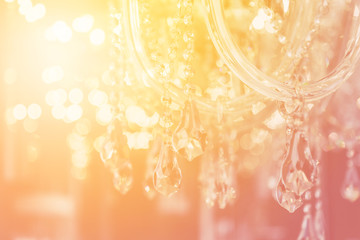Luxury crystal chandelier close-up. Glamour background with copy space