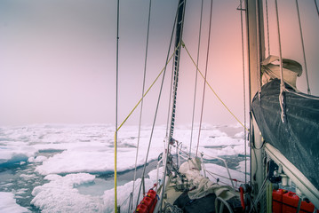 Greenland, sailing boat trough the iceberg, risk, danger in the north pole