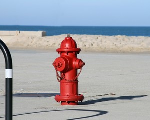 Red fire hydrant near the beach