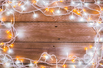 christmas light wire on wooden floor background with free copy space