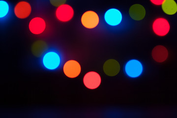 Colorful Bokeh. Lights, Garland, Night City. Christmas Party. Black Background.