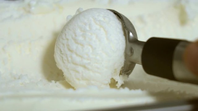 Vanilla ice cream being scooped. Close-up view.