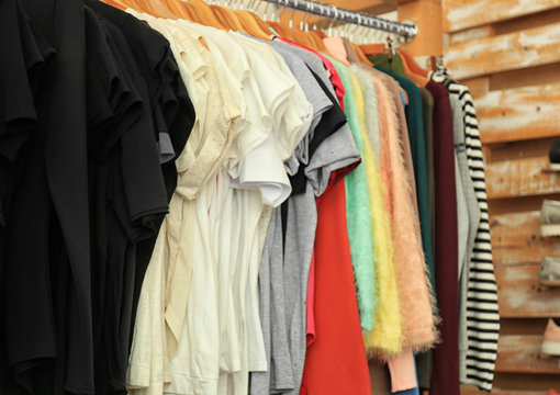 Female clothes on rack in boutique
