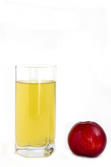Glass of juice and red apples