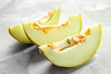 Yummy melon slices on table