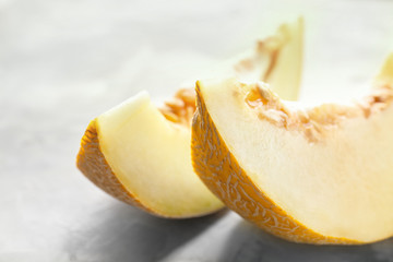 Yummy melon slices on table