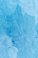 Fototapeta na wymiar Texture of glacier ice in close-up detail