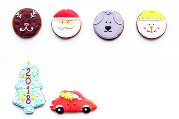 New Year Eve's recipes. Gingerbread cookies with confictionery glaze on white background top view copyspace