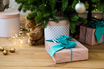 Gift boxes under Christmass tree