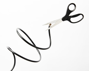 Scissors cutting coaxial cable
