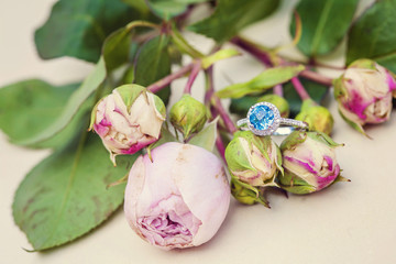 Round topaz gemstone engagement ring on natural romantic background