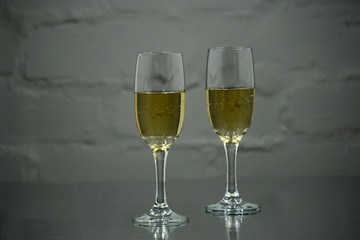 toast of champagne glasses, background of blurred lights